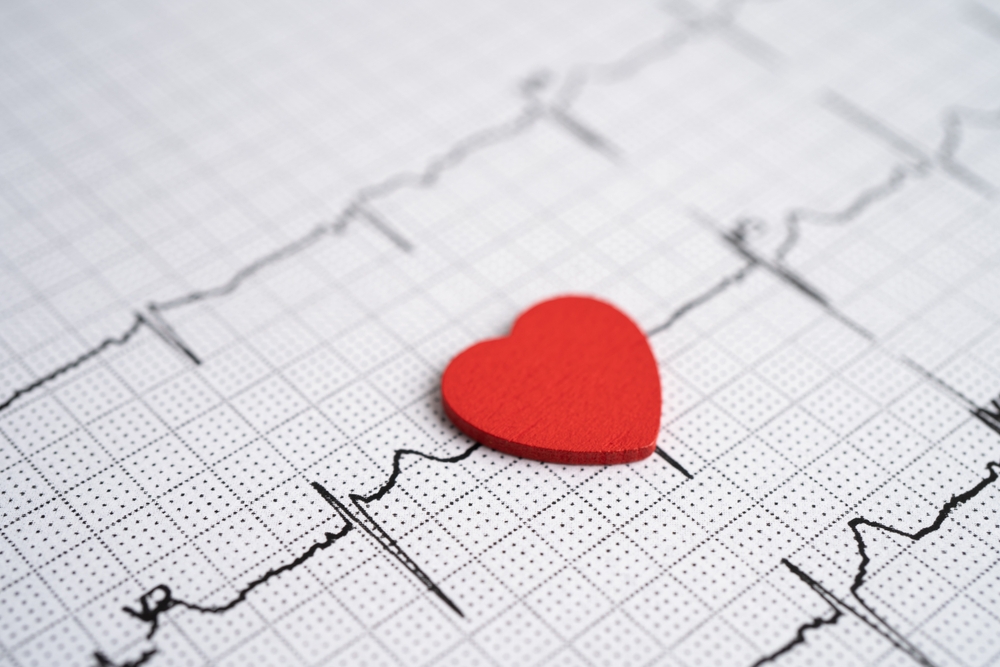 Electrocardiogram, ECG with red heart, heart wave, heart attack, cardiogram report.